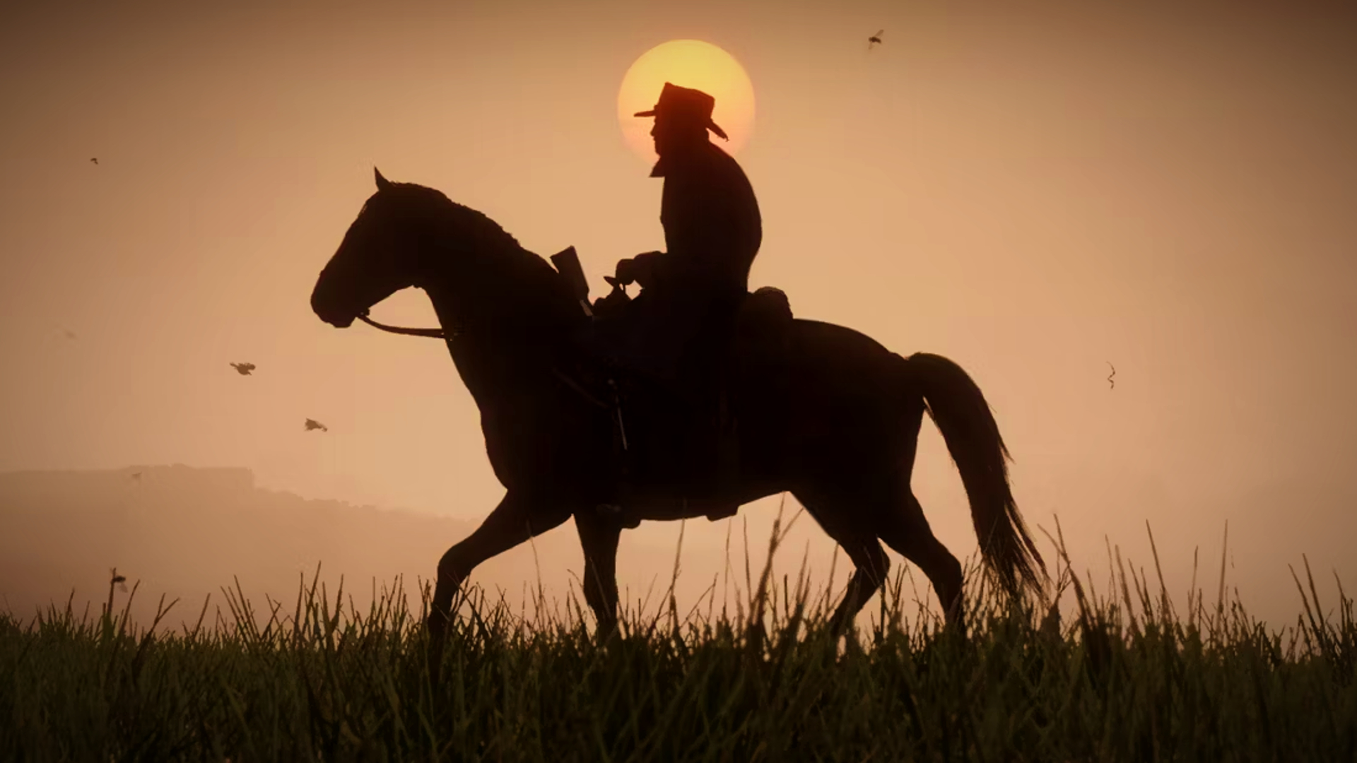 Скриншот из Red Dead Redemption 2, на котором изображен силуэт мужчины в ковбойской шляпе верхом на лошади, а позади него — сияющее солнце.
