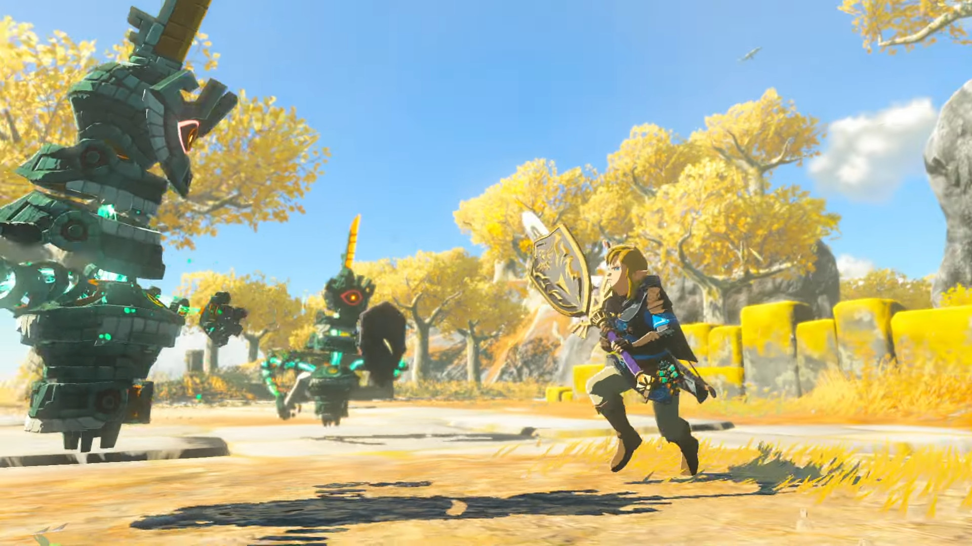 Скриншот из игры The Legend of Zelda: Tears of the Kingdom, на котором Линк сражается с врагами-конструкциями, используя в качестве оружия меч и щит, объединенные в одно оружие.