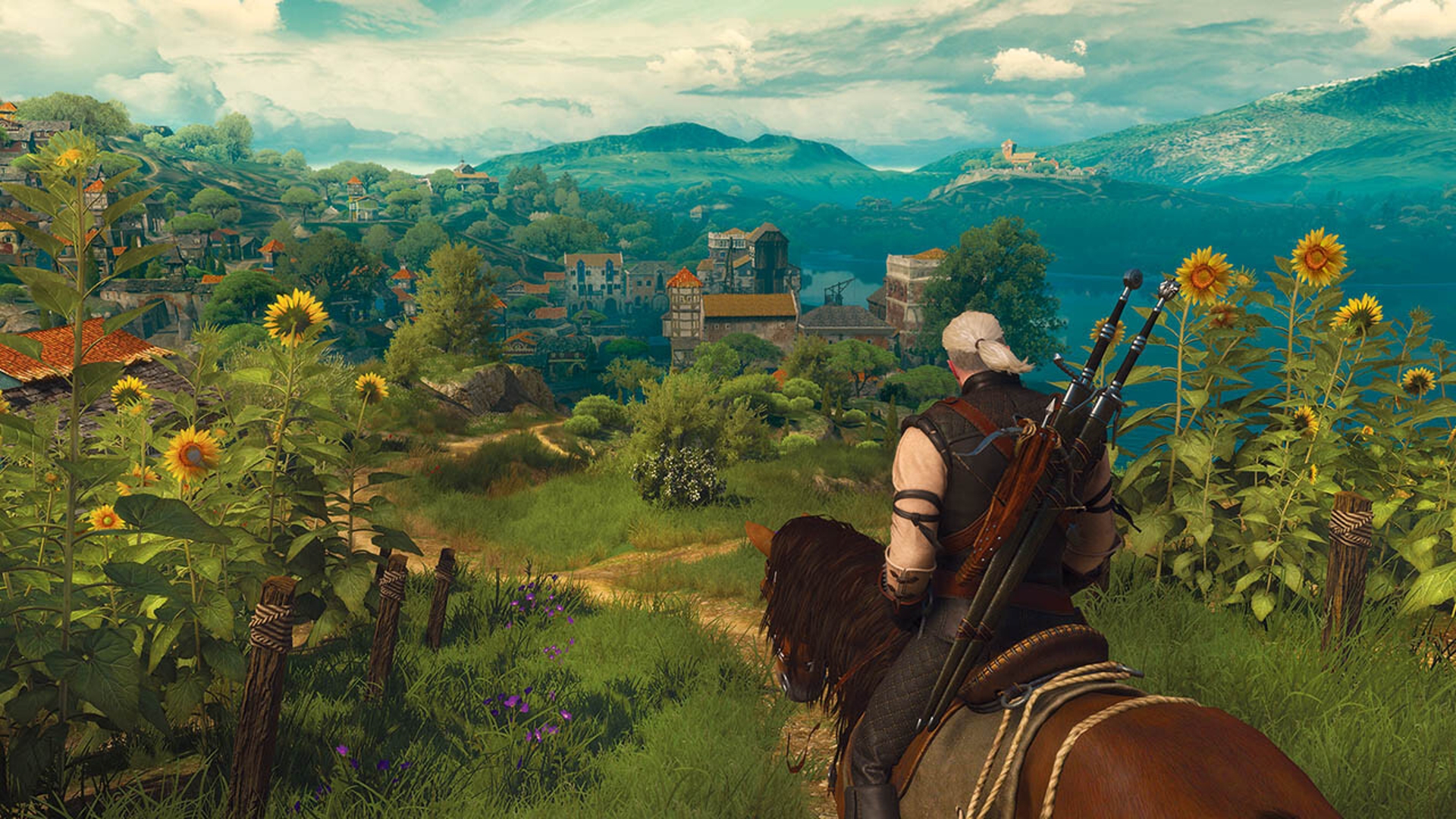 Геральт из Ривии смотрит на город в дополнении Blood and Wine к игре The Witcher 3.